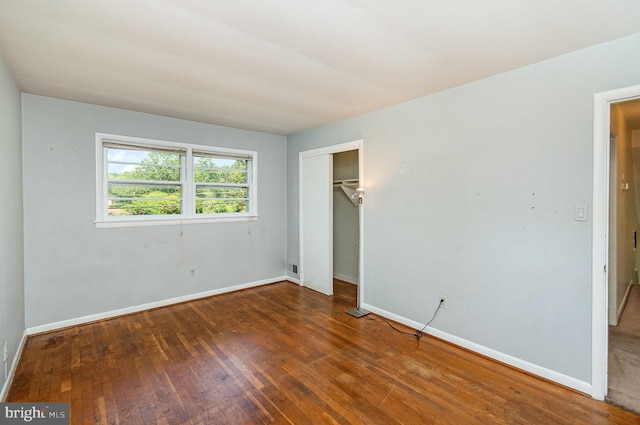 8809 Vernon View Dr, Alexandria, VA 22308 - unfurnished bedroom featuring wood-type flooring, baseboards, and a closet