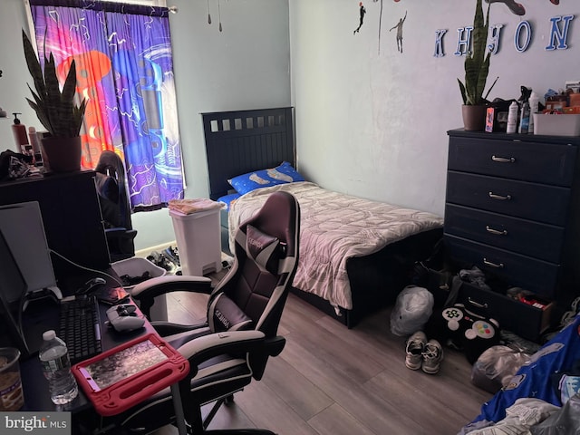 bedroom featuring wood finished floors