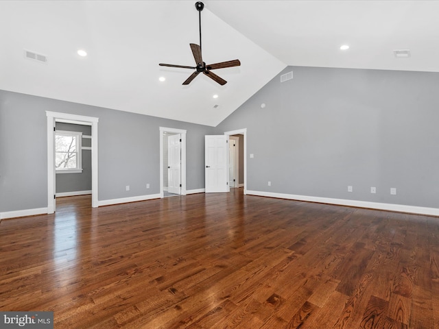 interior space featuring visible vents, a ceiling fan, dark wood-style flooring, and high vaulted ceiling