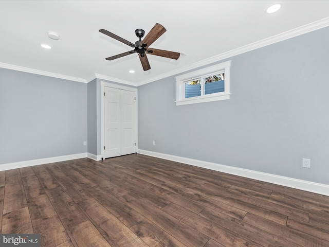 unfurnished bedroom featuring a ceiling fan, crown molding, baseboards, dark wood-style floors, and recessed lighting