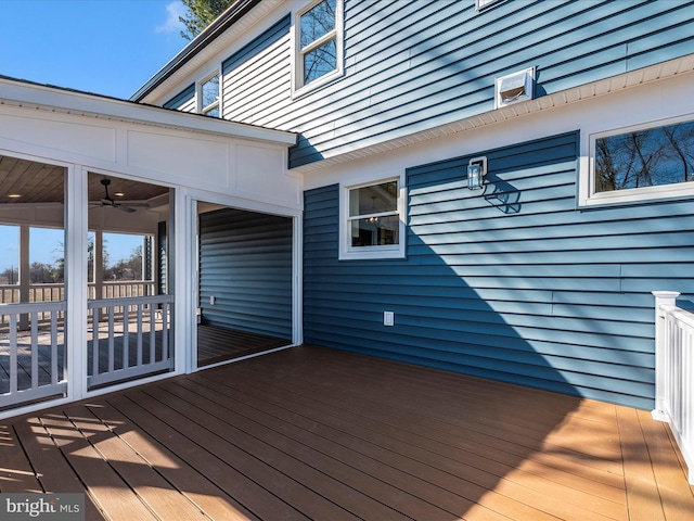 wooden deck featuring a sunroom