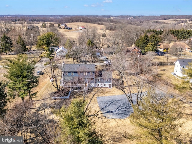 birds eye view of property with a rural view