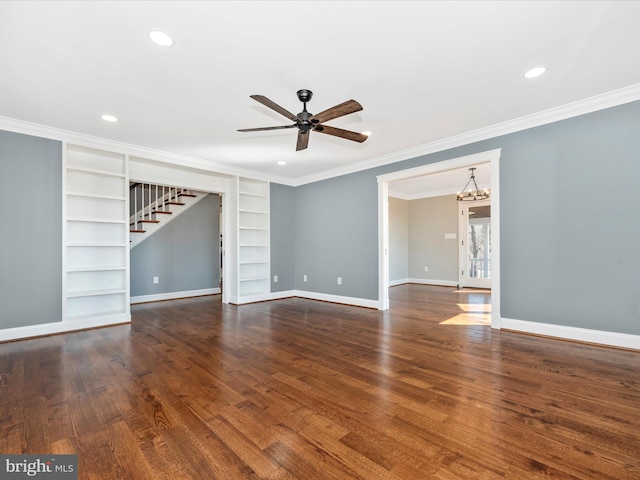 interior space with built in shelves, ceiling fan with notable chandelier, stairs, recessed lighting, and baseboards