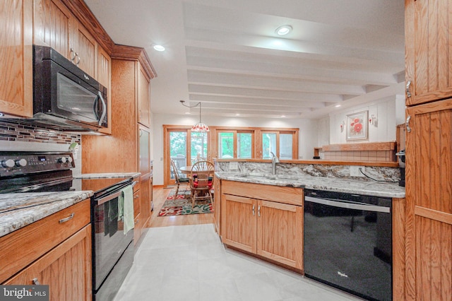 606 5th St, Newark, DE 19711 - kitchen with black appliances, a sink, decorative backsplash, light stone countertops, and recessed lighting