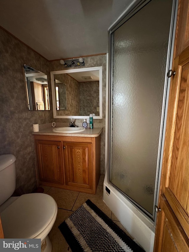 724 Monmouth Rd Unit 38, Cream Ridge, NJ 08514 - full bathroom featuring tile patterned flooring, a shower with door, toilet, and vanity