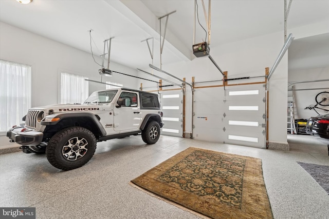 garage featuring a garage door opener