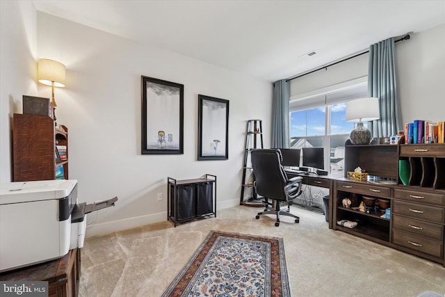 office with carpet floors, baseboards, and visible vents