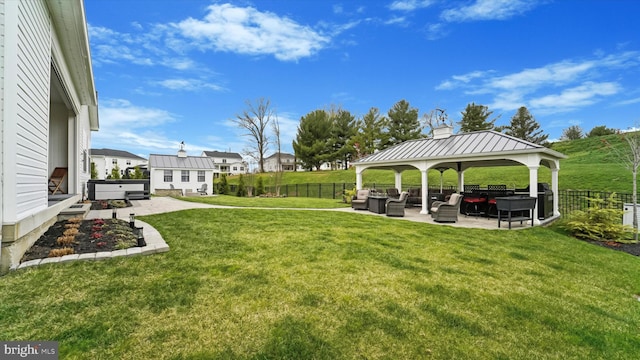 view of yard featuring a patio, a gazebo, fence private yard, and an outdoor hangout area