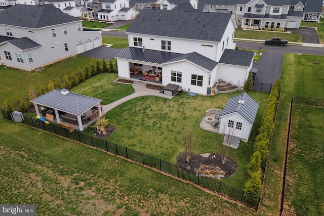 birds eye view of property with a residential view