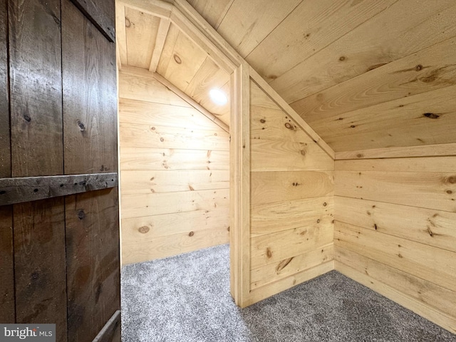 bonus room with wood walls, carpet, and wood ceiling