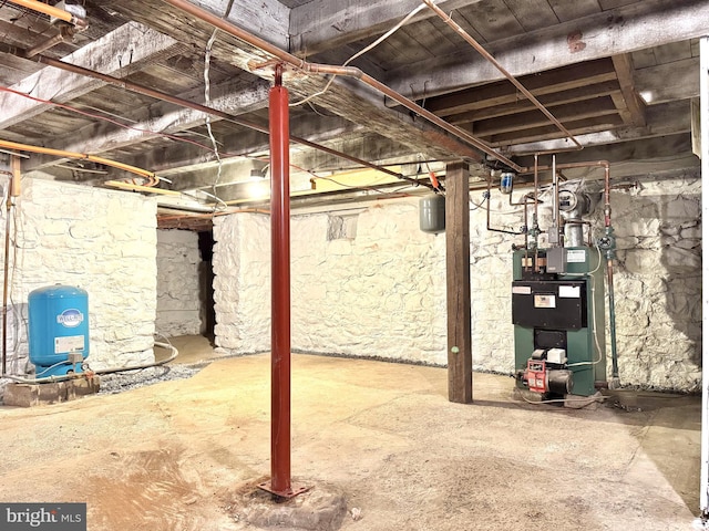 unfinished below grade area with a heating unit