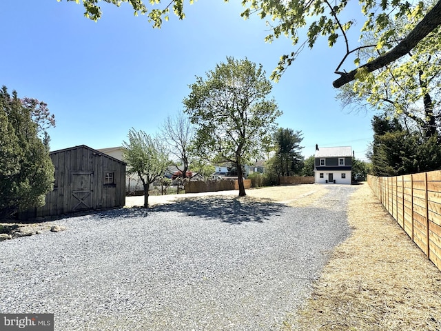view of road featuring gravel driveway