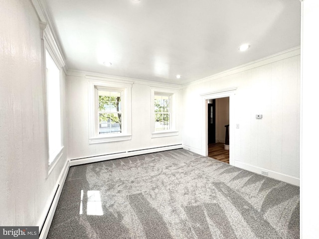 carpeted spare room featuring baseboards, ornamental molding, a baseboard heating unit, and recessed lighting