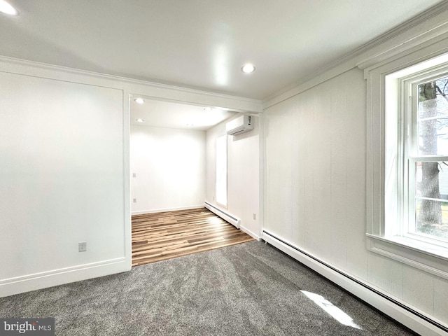 below grade area with an AC wall unit, a baseboard radiator, carpet, and crown molding