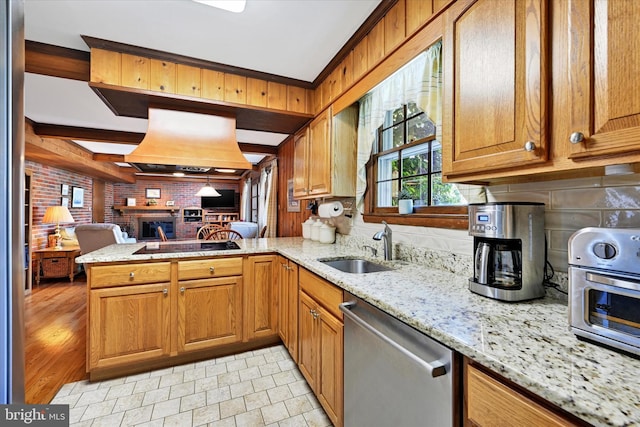 122 Tregarone Rd, Lutherville Timonium, MD 21093 - kitchen with stainless steel dishwasher, a peninsula, light stone countertops, open floor plan, and a sink