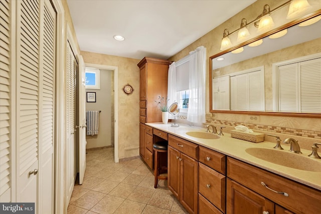 122 Tregarone Rd, Lutherville Timonium, MD 21093 - full bathroom featuring a sink, tile patterned floors, a closet, and double vanity