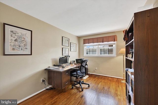 122 Tregarone Rd, Lutherville Timonium, MD 21093 - home office featuring baseboards and hardwood / wood-style flooring