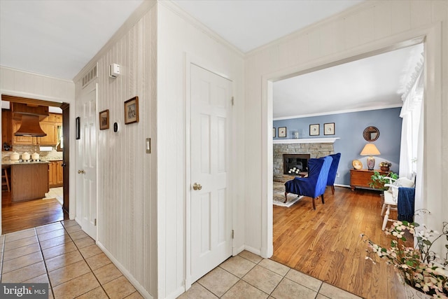 122 Tregarone Rd, Lutherville Timonium, MD 21093 - hall with visible vents, ornamental molding, baseboards, and light tile patterned flooring