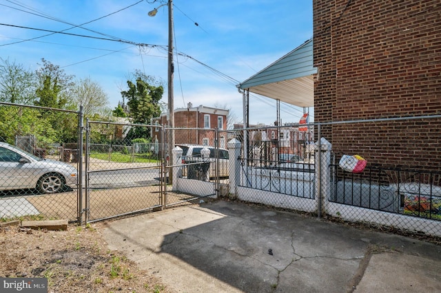view of gate featuring fence