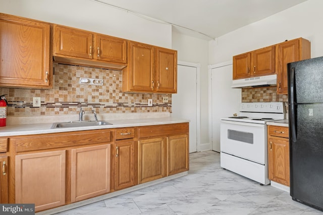 kitchen with white range with electric stovetop, a sink, marble finish floor, freestanding refrigerator, and under cabinet range hood