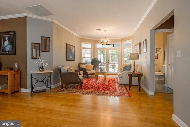 7645 E Longfield Dr, Hebron, MD 21830 - living area with crown molding, an inviting chandelier, light wood finished floors, baseboards, and visible vents