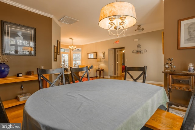 7645 E Longfield Dr, Hebron, MD 21830 - bedroom featuring a chandelier, baseboards, wood finished floors, visible vents, and ornamental molding