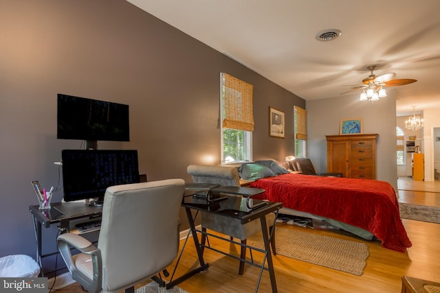 7645 E Longfield Dr, Hebron, MD 21830 - bedroom featuring visible vents, wood finished floors, and a notable chandelier