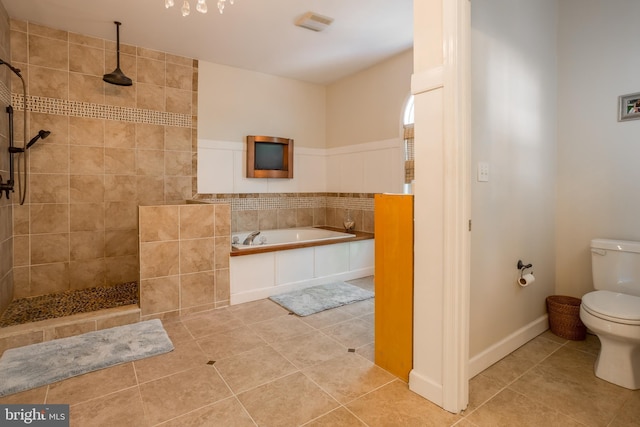 7645 E Longfield Dr, Hebron, MD 21830 - bathroom with tile patterned flooring, walk in shower, toilet, and a bath