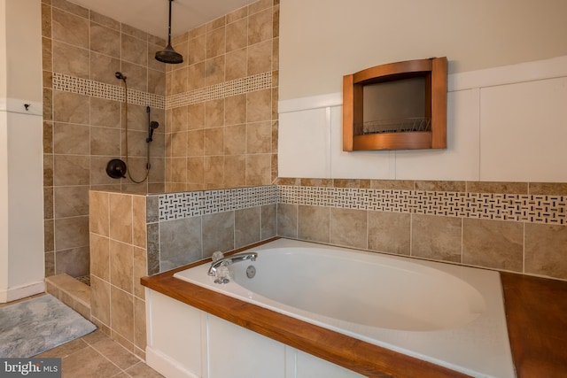 7645 E Longfield Dr, Hebron, MD 21830 - bathroom featuring tile walls, a tile shower, tile patterned floors, and a bath