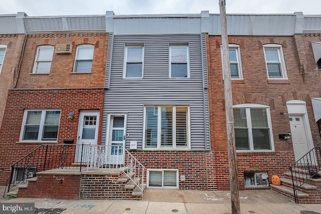 view of property featuring brick siding