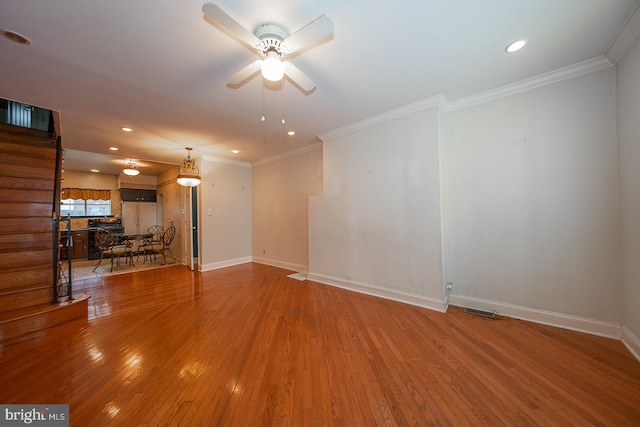unfurnished living room featuring recessed lighting, ceiling fan, baseboards, and wood finished floors