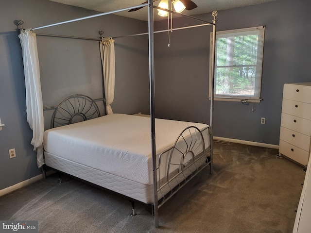 carpeted bedroom with baseboards and ceiling fan
