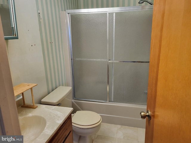 full bath with toilet, wallpapered walls, bath / shower combo with glass door, and vanity
