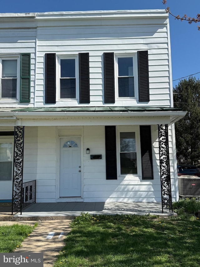 view of front of property featuring a porch and central air condition unit