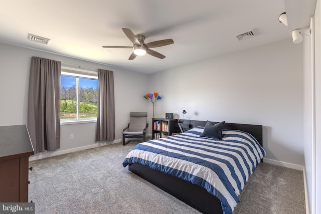 carpeted bedroom featuring baseboards, visible vents, and ceiling fan