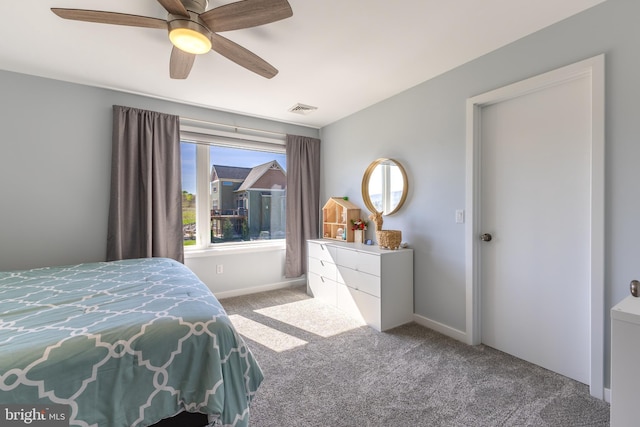 bedroom with visible vents, carpet flooring, baseboards, and a ceiling fan