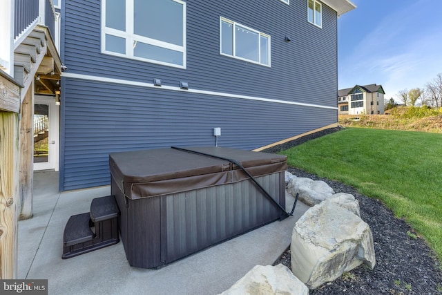 exterior space with a hot tub