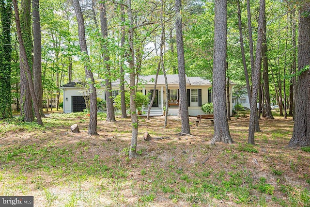 ranch-style home featuring a garage