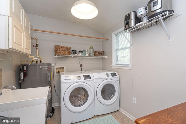 laundry room featuring independent washer and dryer, light tile patterned flooring, a sink, baseboards, and electric water heater