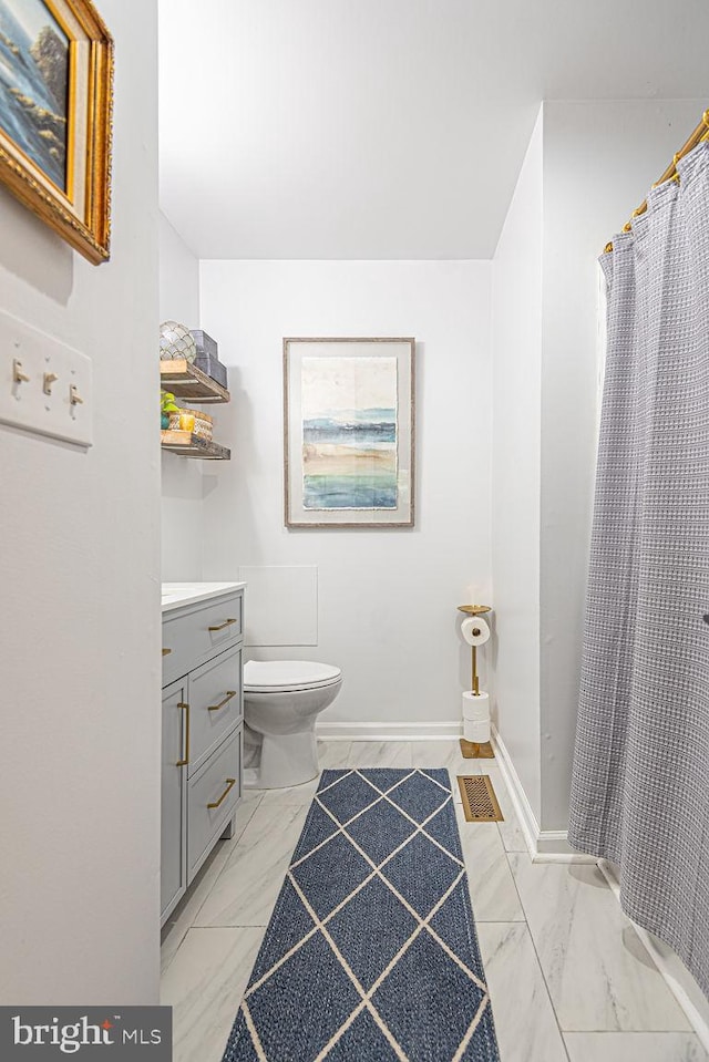 full bath featuring a shower with curtain, visible vents, vanity, toilet, and marble finish floor