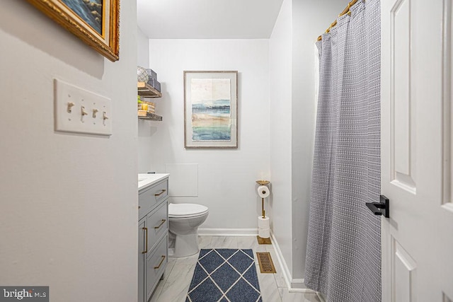 bathroom featuring vanity, visible vents, toilet, and a shower with curtain