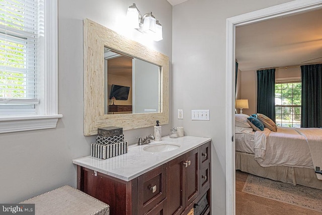 ensuite bathroom with vanity and ensuite bath