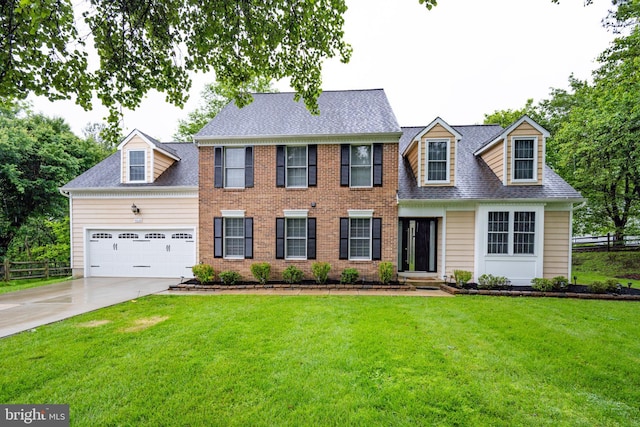 view of front of house featuring driveway, a garage, and a shingled roof