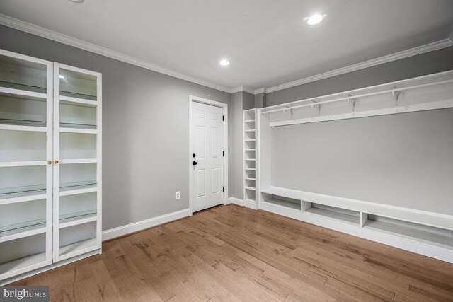 mudroom with ornamental molding, recessed lighting, wood finished floors, and baseboards