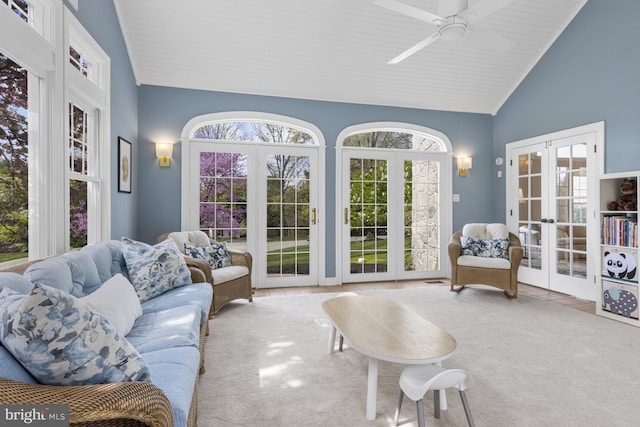 interior space with french doors, carpet, ceiling fan, and high vaulted ceiling