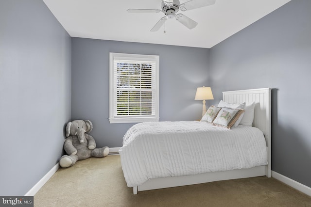bedroom with baseboards, ceiling fan, and carpet