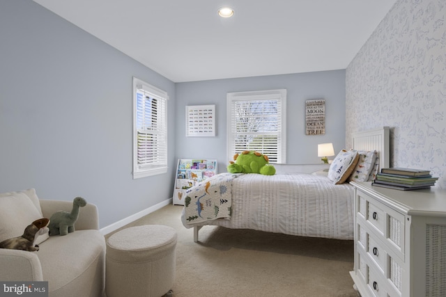 bedroom with baseboards, carpet floors, multiple windows, and wallpapered walls
