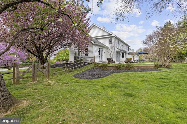 view of yard featuring fence and a patio area