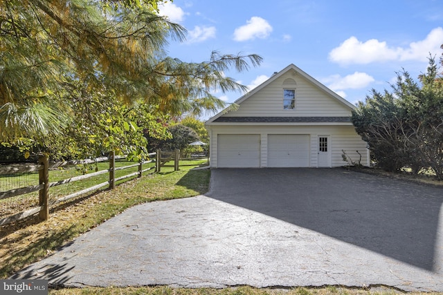 detached garage with fence