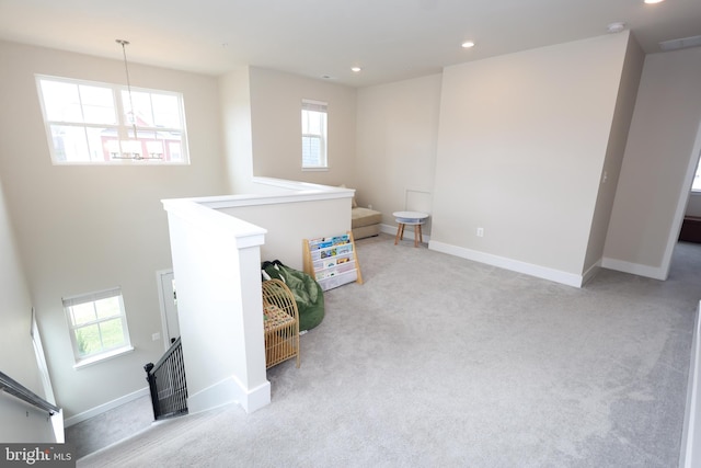 below grade area with carpet flooring, plenty of natural light, recessed lighting, and baseboards